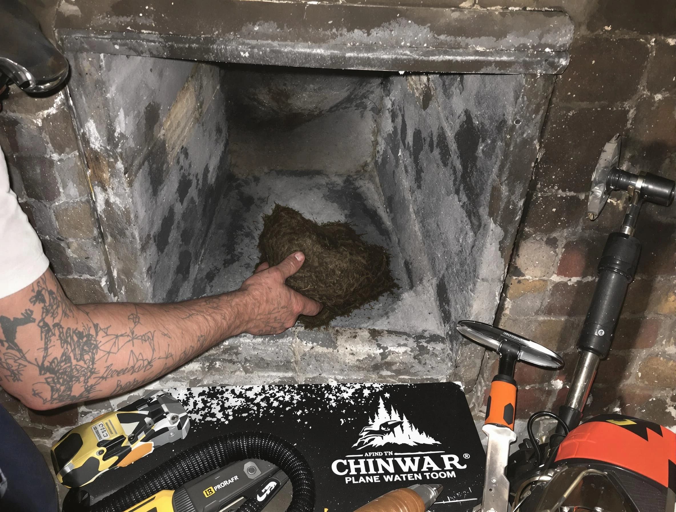 Kennesaw Chimney Sweep safely removing debris and screening chimney in Kennesaw, GA